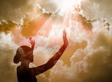 Image of woman with hands to sky