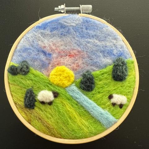Needle Felted wool pasture scene with sheep in an embroidery hoop