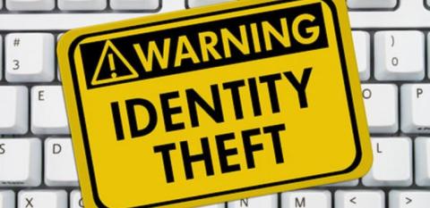 Yellow warning sign: Identity Theft