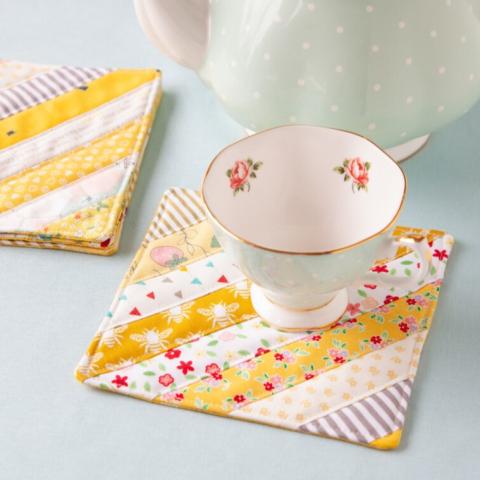 yellow quilted coasters with tea cup
