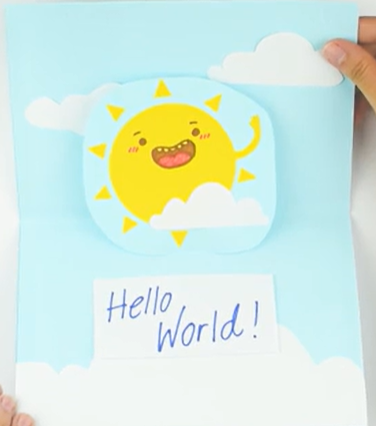 yellow sun with smile on blue background with white clouds and words saying hello world!