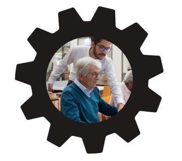 black gear frame with picture of younger adult helping older adult with technology