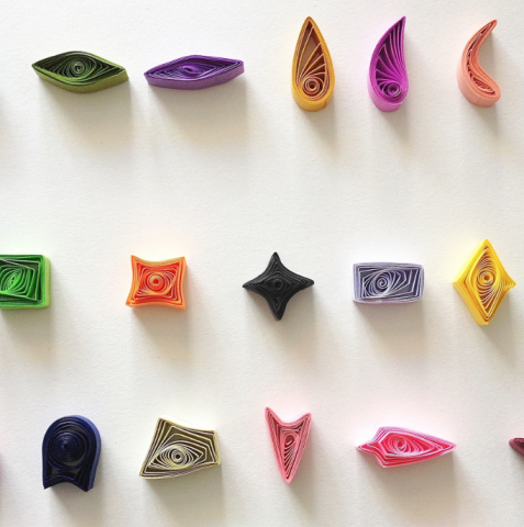 different colors of paper in paper quilling shapes