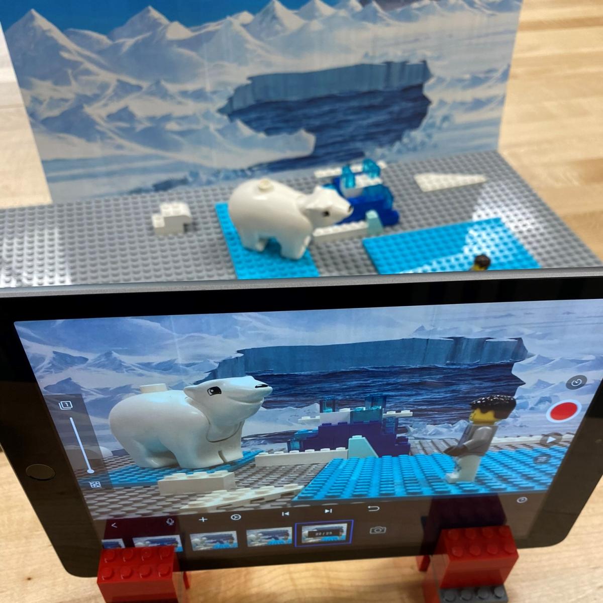 iPad showing recording stop motion animation of LEGO polar bear with a minifigure.