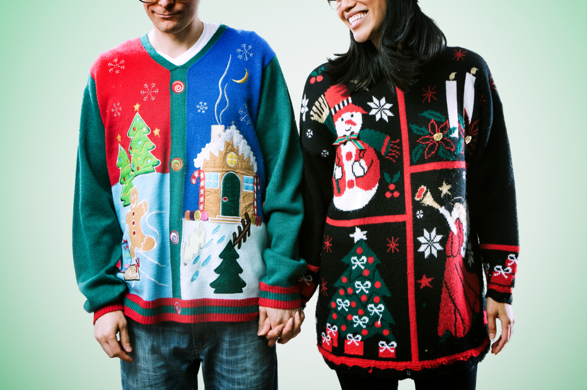 Couple wearing holiday sweaters