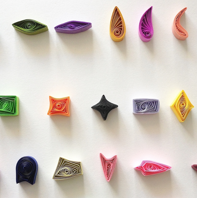 different colors of paper in paper quilling shapes
